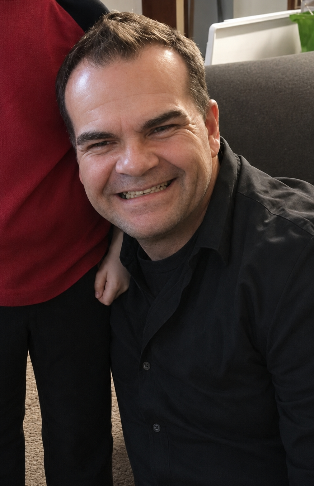 Anthony Corona smiling in a casual photo